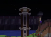 A screenshot from someone's stream. It shows Tommy's watchtower, tall and thin, sitting on the shore of the prison's lake. Built from dark oak logs and stone bricks, it will serve as a perfect shelter to watch the land below.