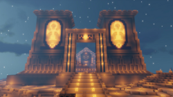 A screenshot from someone's stream. It shows the entrance to Foolish's Summer Home, an Ancient Egyptian-themed build. The front entryway is all lit up with ankh symbols. Through the arch, we can see the head of a massive sphinx. Stairs lead through the sand up to the sphinx.