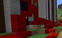 A screenshot from someone's stream. It shows a small section of Eret's fortress covered in red blood vines. They snake across the ground and even go up the side of the wall.