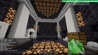 A screenshot from Sam's stream. He's standing in the lobby to the prison. The room is made out of blackstone and redstone lanters. White pillars and trim decorate the corners of the room.