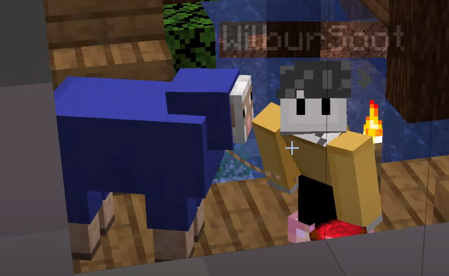 A screenshot from someone's stream. It shows Ghostbur holding a lead attached to a blue sheep. In his off-hand, he holds something red.