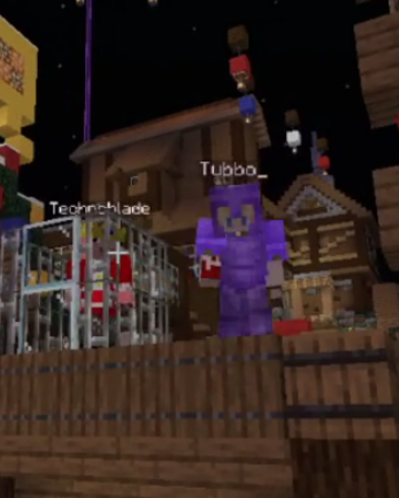 This is a screenshot from someone's stream. It shows Techno standing in the cage while Tubbo is on stage next to him in full netherite armor, talking to the crowd.