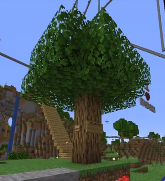 A screenshot from someone's stream. It's a picture of an oak tree in minecraft with an oak sign on the front reading The L'mantree. There is also a single oak button next to it. This screenshot was taken well before Doomsday.